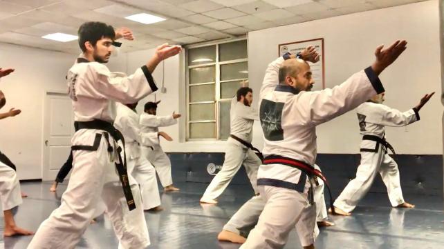 A group of people in karate uniforms Description automatically generated with medium confidence