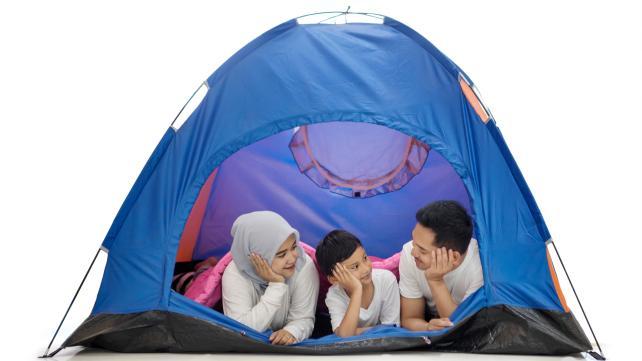 A group of people in a tent Description automatically generated