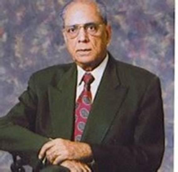 A person in a suit and tie Description automatically generated with medium confidence
