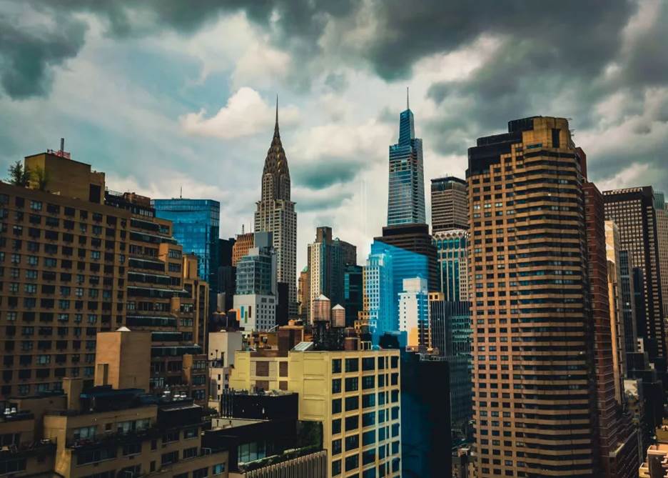 A picture containing cloud, tower block, sky, metropolis Description automatically generated
