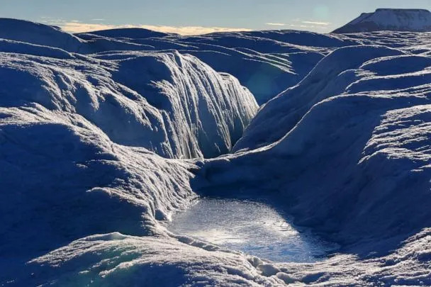 PHOTO: A pool of frozen water rests on the bumpy, often wet surface of Petermann glacier on Aug. 27, 2016. (The Washington Post via Getty Im)