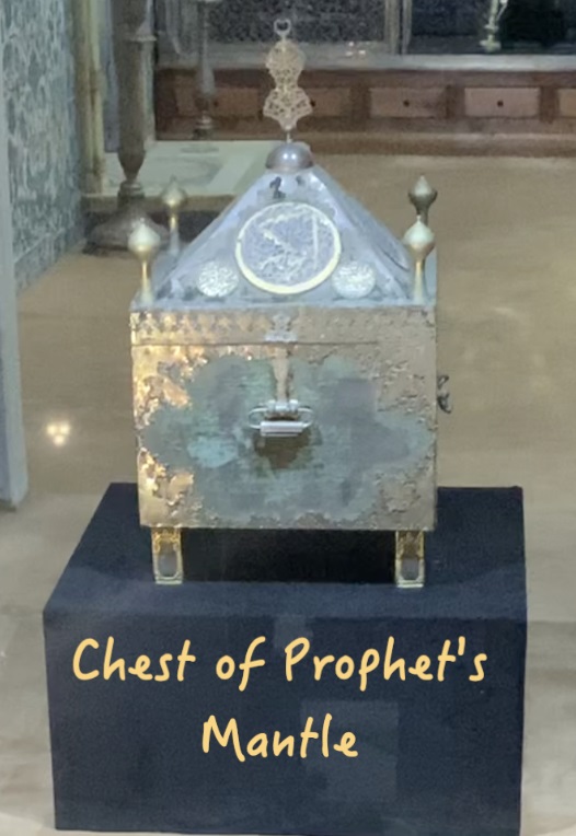 A picture containing funeral, box, sign Description automatically generated