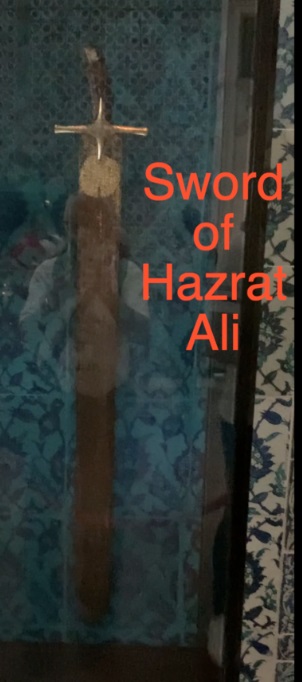 A sword in a glass case Description automatically generated with low confidence