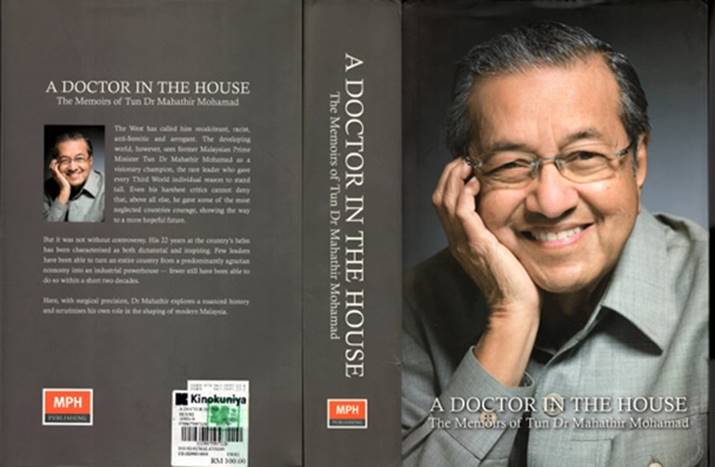 A person smiling and holding his hand on his face Description automatically generated