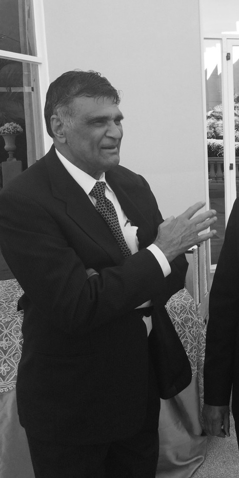 A person in a suit and tie  AI-generated content may be incorrect.