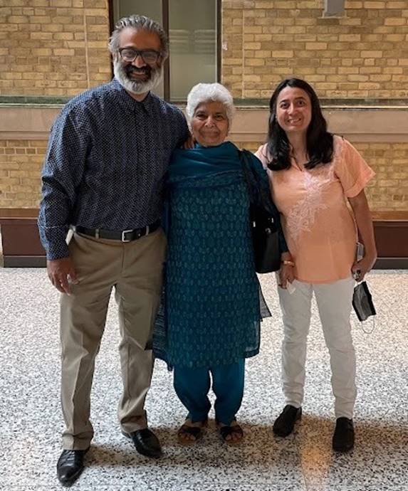 A group of people posing for a photo  AI-generated content may be incorrect.