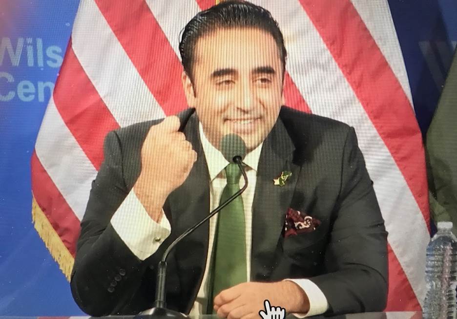 A picture containing person, person, wearing, suit Description automatically generated