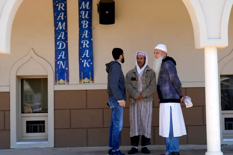 People are shown outside Omar Mosque, in Paterson before afternoon prayers. During the morning prayer session, Imam Sayed Elnakib (not shown) was stabbed twice and was taken to St. Joseph Regional Medical, where he is in stable condition. The alleged attacker was praying at the mosque before the attack. Others praying at the mosque apprehended the man before police arrived. Sunday, April 9, 2023