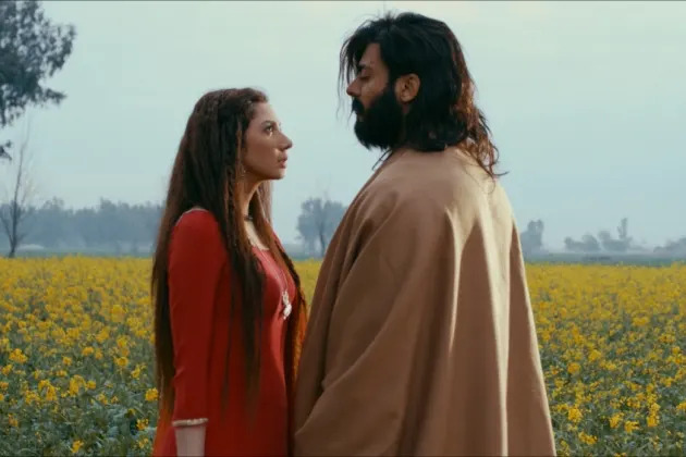 A person and person standing in a field of flowers Description automatically generated with medium confidence
