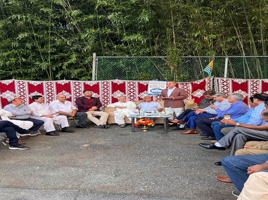 A group of people sitting in a circle Description automatically generated with medium confidence
