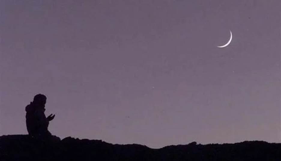 An undated image of a person praying after sighting the moon. — AFP/File