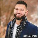 A person with a beard and a scarf Description automatically generated with medium confidence