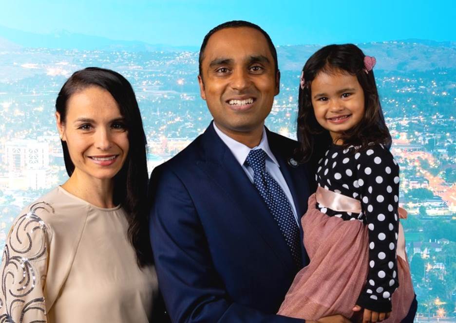 A person and person holding a child Description automatically generated with low confidence