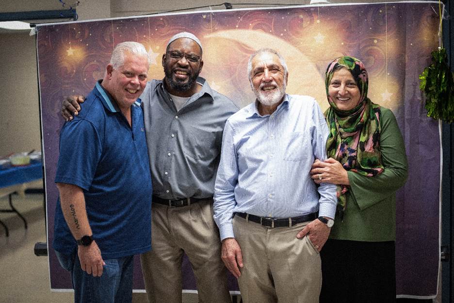 A group of people posing for a photo Description automatically generated
