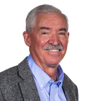 A person in a blue shirt and gray jacket Description automatically generated