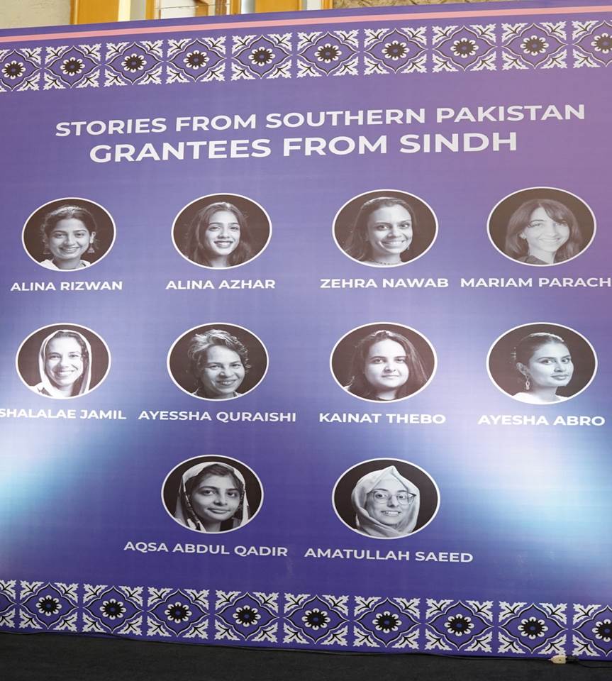 A poster with a group of women Description automatically generated