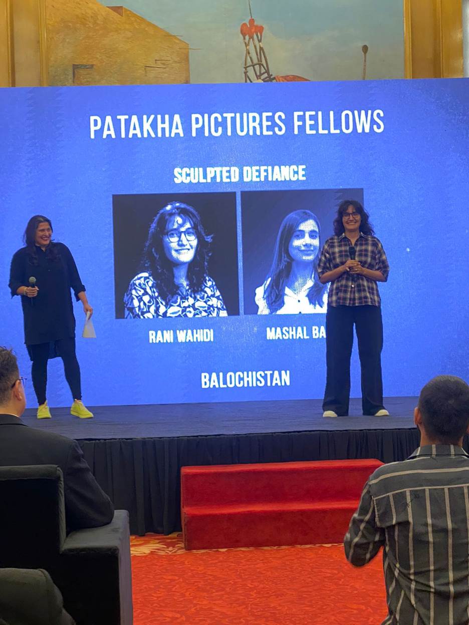 A group of people on a stage Description automatically generated