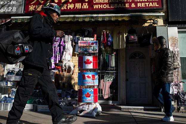 Pedestrians walk in Chinatown