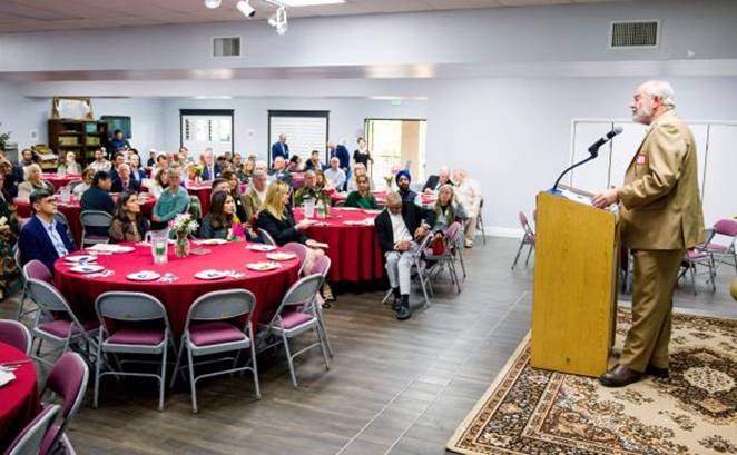 Guest speaker Rabbi Joseph Mendelsohn, right, gives a talk at...