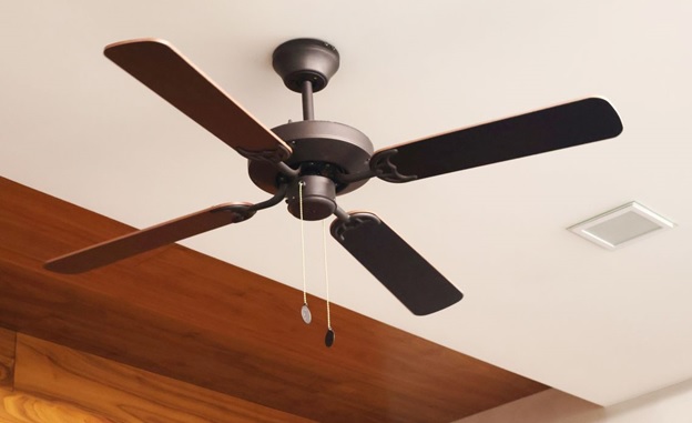A ceiling fan with a wooden ceiling  AI-generated content may be incorrect.