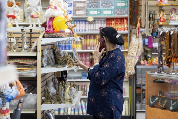 A worker talks on the phone at India Appliances