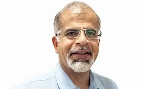 A person with glasses and a beard  AI-generated content may be incorrect.