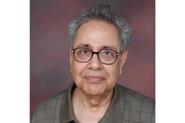 A close-up of a person wearing glasses  AI-generated content may be incorrect.