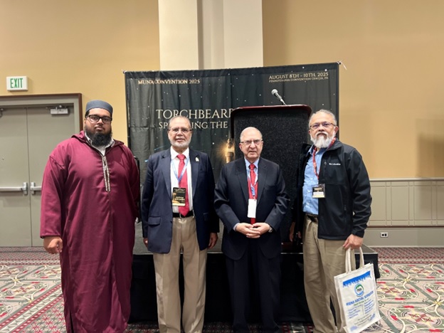 A group of men standing in front of a stage  AI-generated content may be incorrect.