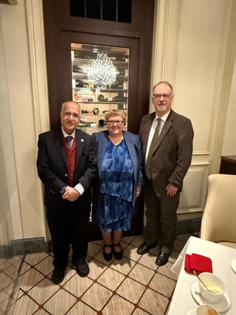 A group of people standing in a room  AI-generated content may be incorrect.