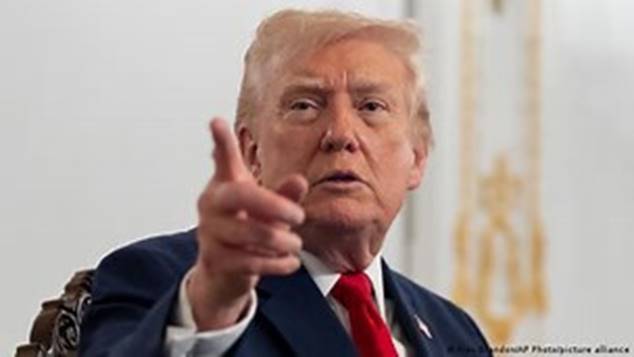 A person in a suit pointing his finger  AI-generated content may be incorrect.