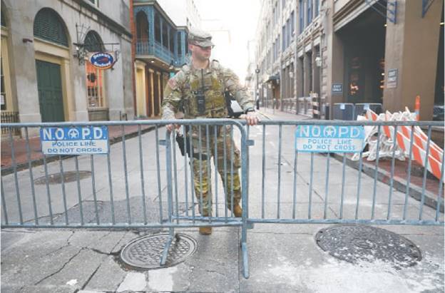 A National guardsman secures the area where people were killed in a truck attack in New Orleans.—Reuters