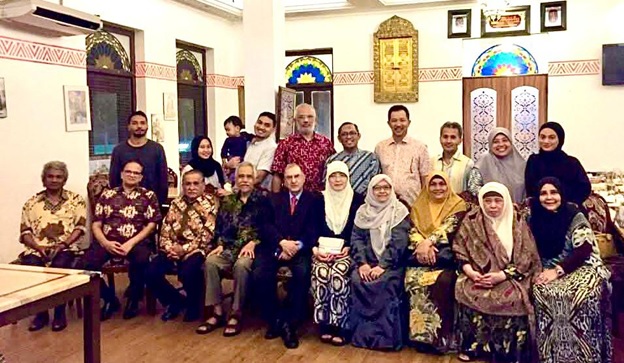 A group of people posing for a photo  AI-generated content may be incorrect.