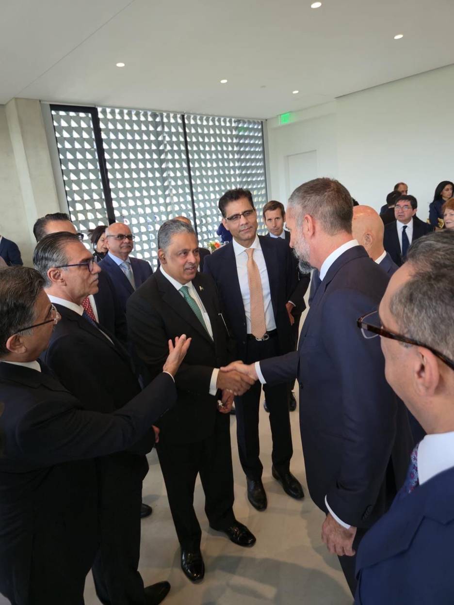 A group of men shaking hands  AI-generated content may be incorrect.