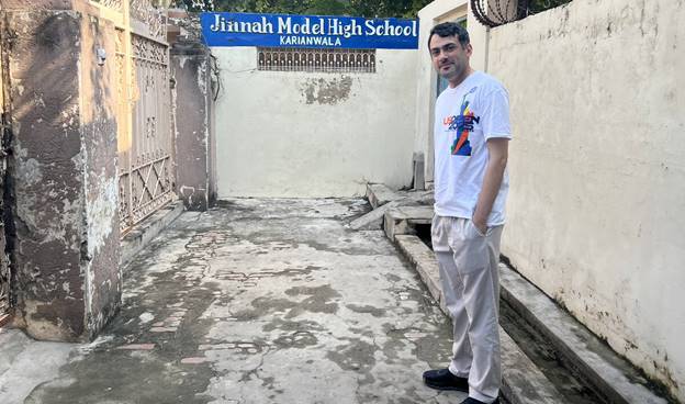 A person standing in a courtyard  AI-generated content may be incorrect.