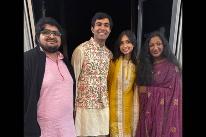 A group of people posing for a photo  AI-generated content may be incorrect.