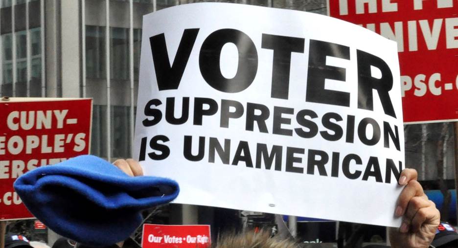 A group of people holding signs Description automatically generated with medium confidence