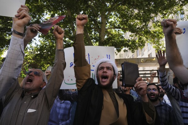 A group of people protesting Description automatically generated