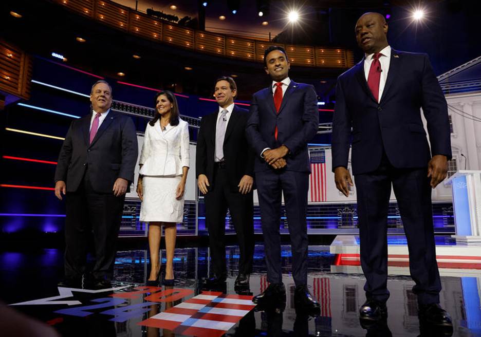 A group of people standing on a stage Description automatically generated