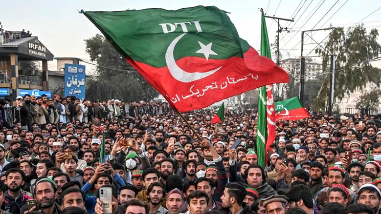 Supporters of Pakistan Tehreek-e-Insaf (PTI) party protest outside the office of a Returning Officer in Peshawar.