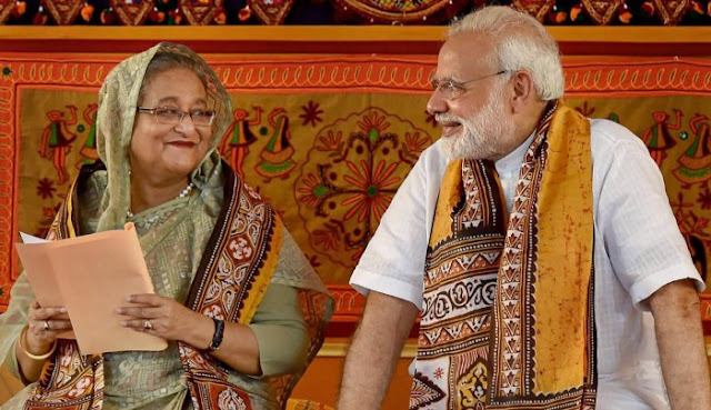 A person and person in traditional clothing Description automatically generated