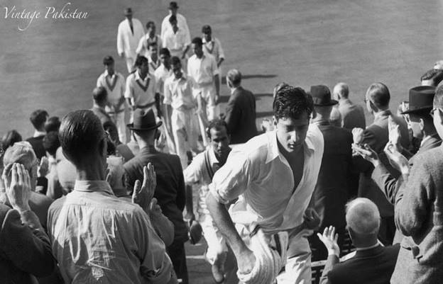 May be a black-and-white image of one or more people, people performing martial arts and crowd