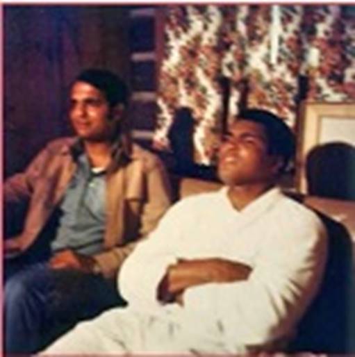 A group of men sitting on a couch  AI-generated content may be incorrect.