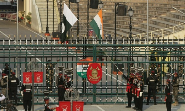 Pakistan Rangers and Indian Border Security Force soldiers lower their national flags at the Pakistan-India joint check post at Wagah border, near Lahore, Pakistan on May 14, 2025. — Reuters/Mohsin Raza