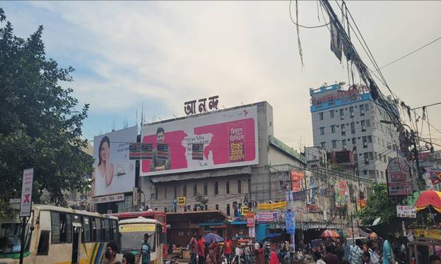 A building with a pink sign  AI-generated content may be incorrect.
