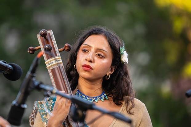 A person playing a musical instrument  AI-generated content may be incorrect.