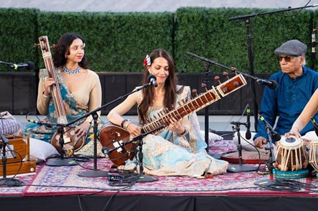 A group of people playing instruments  AI-generated content may be incorrect.